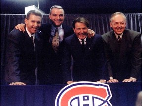 From left to right: new Canadiens GM Réjean Houle, new head coach Mario Tremblay, team president Ronald Corey and new assistant coach Yvan Cournoyer pose for photo during news conference at the Bell Centre on Oct. 21, 1995.