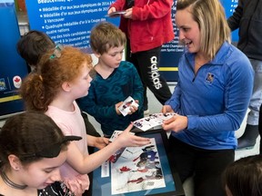 Marie-Philip Poulin is welcomed home from the 2018 Winter Olympic Games in Pyeongchang, South Korea, by members of the Dawson Boys & Girls Club in Verdun on Tuesday, April 3, 2018.