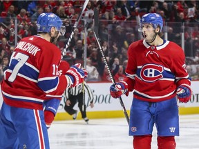 Montreal Canadiens' Phillip Danault celebrates his goal with Ilya Kovalchuk against the Chicago Blackhawks in Montreal on Jan. 15, 2020.