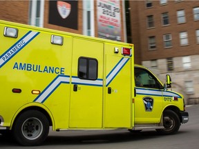 An ambulance arrives at the Montreal General Hospital emergency room in Montreal on Monday, June 15, 2015.