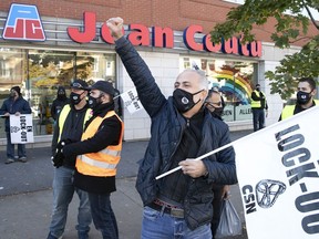 Unionized members of the Jean Coutu Varennes distribution centre hold a protest in front of the store on Parc Ave. on Saturday October 17, 2020.