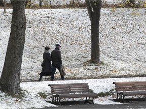 A couple strolls through Lafontaine Park on Nov. 3, 2020, after Montreal's first dusting of snow this season.