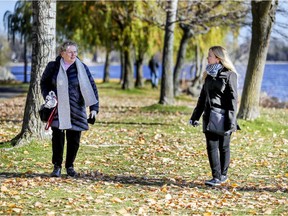 West Island Citizen Advocacy volunteer Corinne (right) walks with Helen in a park in Pointe-Claire.