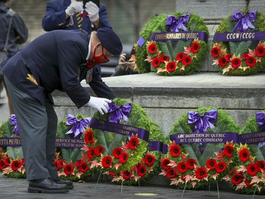 Sylvain Hamel, first vice-president of the Quebec Command of the Royal Canadian Legion, lays a wreath during scaled-down Remembrance Day ceremony at the Cenotaph in Montreal's Place du Canada in 2020.