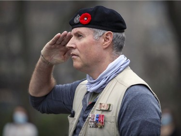 Veteran John Malevich, who served in the Canadian military in Bosnia and Afghanistan, salutes during a scaled-down Remembrance Day ceremony at the Cenotaph in Montreal's Place du Canada in 2020.