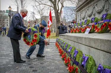 Quebec Lieutenant Governor J. Michel Doyon lays a wreath during a scaled-down Remembrance Day ceremony at the Cenotaph in Montreal's Place du Canada in 2020.