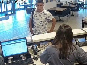 In this screen grab from a surveillance camera inside the Comfort Inn in Pointe-Claire, Kevin Flores has a backpack containing $30,000. He asked the staff at the front desk to call him a taxi.
