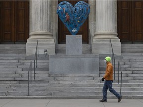 Montrealer walks past the main entrance of the Montreal Museum of Fine Arts on Sunday, Nov. 15, 2020.