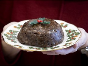 A plum pudding, like the ones available for sale online at the 87th annual fall fair of the Church of St. Andrew and St. Paul, being held online for the first time this year. The plum pudding is being held by Betty-Jo Seath Christiani, the president of the church guild, which is responsible for the fall fair. Her husband, David Christiani, is the convenor of the fall fair this year.