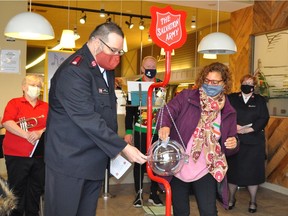 Cornwall City Mayor Bernadette Clement provided the first donation to this year's Salvation Army Kettle Campaign on Saturday at the Cornwall Farm Boy. She is pictured with Major Derran Wiseman.