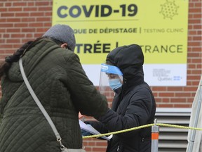 People arrive for COVID-19 testing at CLSC de Parc-Extension on Tuesday November 17, 2020. Tuesday marked the first time in weeks Quebec had dipped below 1,000 daily diagnoses. We were back up to nearly 1,200 on Wednesday.