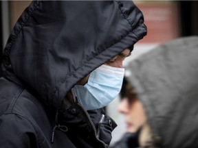 A pedestrian in Verdun wears a mask Nov. 19, 2020.