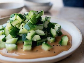 Yotam Ottolenghi's cucumber salad is trimmed with black sesame seeds.
