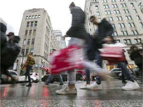 Shoppers walk along Ste-Catherine St. in December 2018: Le Journal de Montréal reported last week that many customers are being greeted in English-only in downtown stores.