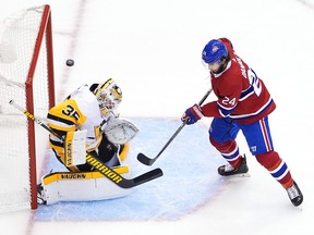 TORONTO, ONTARIO - AUGUST 07:  Tristan Jarry #35 of the Pittsburgh Penguins stops a shot by Phillip Danault #24 of the Montreal Canadiens in the first period in Game Four of the Eastern Conference Qualification Round prior to the 2020 NHL Stanley Cup Playoffs at Scotiabank Arena on August 07, 2020 in Toronto, Ontario.