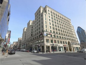 The corner of Peel and St-Catherine Sts. in the middle of the day in the heart of downtown Montreal March 18, 2020.