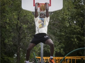 Basketball player Karim Mané dunks at a court near his home in St-Hubert on July 23, 2020.
