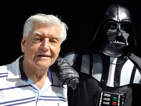 This file photo taken on April 27, 2013 during a Star Wars convention in Cusset, central France, shows David Prowse, the British actor behind the menacing black mask of Star Wars villain Darth Vader, who died aged 85 his agent said on November 29, 2020.