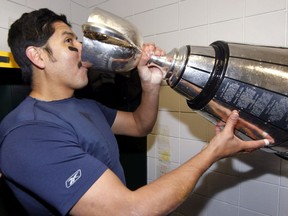 Montreal Alouettes quarterback Anthony Calvillo drinks from the Grey Cup after defeating the Saskatchewan Roughriders at Commonwealth Stadium in Edmonton on Nov. 28, 2010.