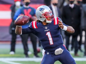 New England Patriots quarterback Cam Newton passes the ball against the Arizona Cardinals at Gillette Stadium in Foxborough, Mass., on Sunday, Nov. 29, 2020.