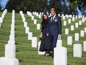 Prince Harry, Duke of Sussex and Meghan, Duchess Of Sussex lay a wreath at Los Angeles National Cemetery on Remembrance Sunday on November 8, 2020 in Los Angeles, California. PHOTO BY LEE MORGAN/HANDOUT VIA GETTY IMAGES.