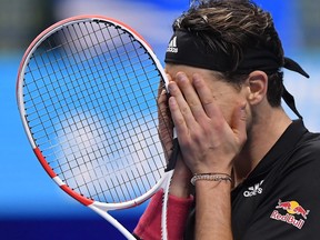 Austria's Dominic Thiem celebrates winning his semi-final match against Serbia's Novak Djokovic at the ATP Finals in London on Saturday, Nov. 21, 2020.