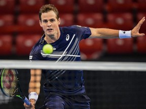 Vasek Pospisil hits a return against Richard Gasquet during the semifinal match of the ATP 250 Sofia Open in Sofia, Bulgaria, on Friday, Nov. 13, 2020.