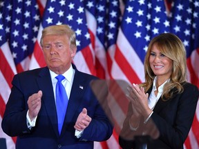 Donald Trump claps alongside U.S. First Lady Melania Trump after speaking during election night in the East Room of the White House in Washington overnight.