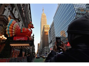 People enjoy the Thanksgiving decorations at Macy's Herald Square store in New York City on Nov. 24.