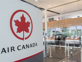An Air Canada check-in area is shown at Montreal-Pierre Elliott Trudeau International Airport on May 16, 2020. Air Canada says it is bolstering its summer schedule, which remains more than 50 per cent smaller than last year as the COVID-19 pandemic continues to pound the airline industry.