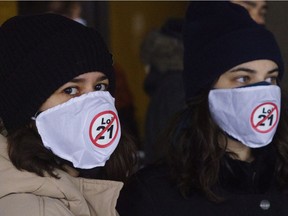 Demonstrators stand outside the courthouse on the first day of the constitutional challenge to Bill 21 before Quebec Superior Court in Montreal on Monday, November 2, 2020.