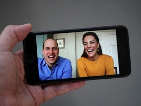 In this photo illustration Prince William, Duke of Cambridge and Catherine, Duchess of Cambridge are seen in conversation with Casterton Primary Academy students via video chat on April 09, 2020 in London, United Kingdom.