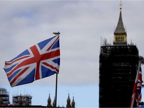 The Union flag flies above a souvenir stand in front of Big Ben in London, Friday, Oct. 16, 2020. Canada and Britain say they are in the final stages of negotiating a new trade deal before a Dec. 31 deadline.