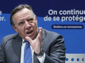 Premier Francois Legault responds to a question during a news conference in Montreal, on Tuesday, November 17, 2020. "The provincial government recently has been criticized for its decisions to order the closing of certain businesses and institutions, and not others. Often, the decisions about pandemic measures seem arbitrary and, to many of us, unjustifiable," Martine St-Victor writes.