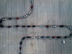 An aerial view of vehicles waiting at a drive-thru COVID-19 testing site in the parking lot of Miller Park, as the coronavirus (COVID-19) disease outbreak continues in Milwaukee on Nov. 5, 2020.