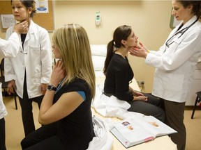 First-year Physician Assistant Education students at McMaster University in Hamilton, Ont. practise assessing a patient's thyroid gland on Tuesday, February 2, 2010.