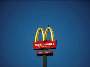 The McDonald's company logo stands on a sign outside a restaurant in Bretigny-sur-Orge, near Paris, France, July 30, 2020.