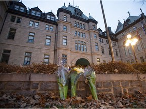 Flowers in front of city hall in Quebec City Nov. 1, 2020. Two people were killed and five injured after a man wielding a sword attacked passers-by in the historic quarter of the city.