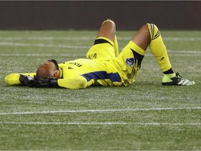 Montreal Impact goalkeeper Clément Diop lies on the pitch after a 2-1 loss to the New England Revolution at Gillette Stadium on Nov. 20, 2020, in Foxborough, Mass.