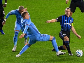 Montreal Impact midfielder Samuel Piette, right, and New York City defender Guðmundur Þorarinsson (20) battle for the ball during the first half at Yankee Stadium in New York on Oct. 24, 2020