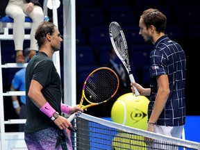 Russia's Daniil Medvedev, right, with Spain's Rafael Nadal after winning their semi-final match at the ATP Finals in London on Saturday, Nov. 21, 2020.