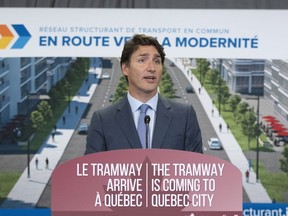 Prime Minister Justin Trudeau announces a major investment for a tramway in Quebec City last year.