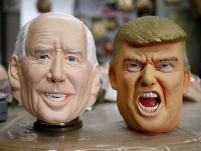 Masks depicting U.S. President-elect Joe Biden and President Donald Trump are displayed at Ogawa Studios, a mask and toy making company, in Saitama, Japan, Nov. 12, 2020.