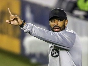 Montreal Impact manager Thierry Henry directs his players during MLS game against the Vancouver Whitecaps in Montreal on Aug. 25, 2020.