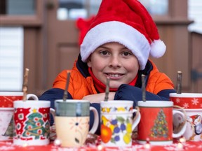 Liam Warnock, 9, started his first business Tweety Treats in June, making bird feeders from second-hand mugs which he is pictured here selling at the Christmas Market in the Beaurepaire Village in Beaconsfield on Saturday.