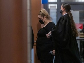 Sandra Testa, left, heads back into court at Montreal's Palais de justice after a break on Thursday December 10, 2020. Phi Centre founder Phoebe Greenberg alleges Testa used her position to take advantage of Greenberg’s trust and gradually take $15 million from her.