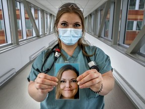 Royal Victoria Hospital respiratory therapist Jennifer Hostetter holds up a picture of herself. Hospital employees clip the photos on their uniforms so patients can see what they look like behind the masks they must wear at all times due to COVID-19.