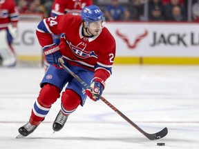 Canadiens Phillip centre Danault carries the puck past centre ice against the Boston Bruins in Montreal on Dec. 17, 2018.