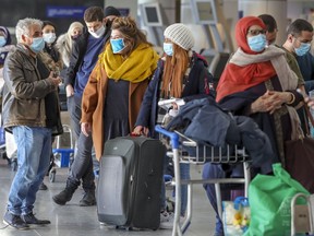 Travellers line up for a Turkish Air flight. Between 12,000 and 13,000 passengers were expected to pass through Trudeau airport on Friday.