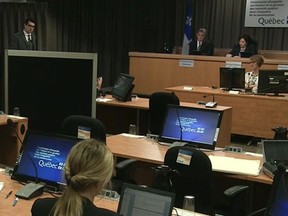 An unidentified engineer from the firm Roche — since renamed Norda Stelo — testifies behind a screen to protect his identity at the Charbonneau Commission in June 2014.